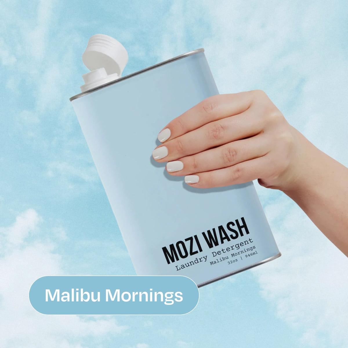 Malibu Mornings Mozi Wash laundry detergent bottle held in hand