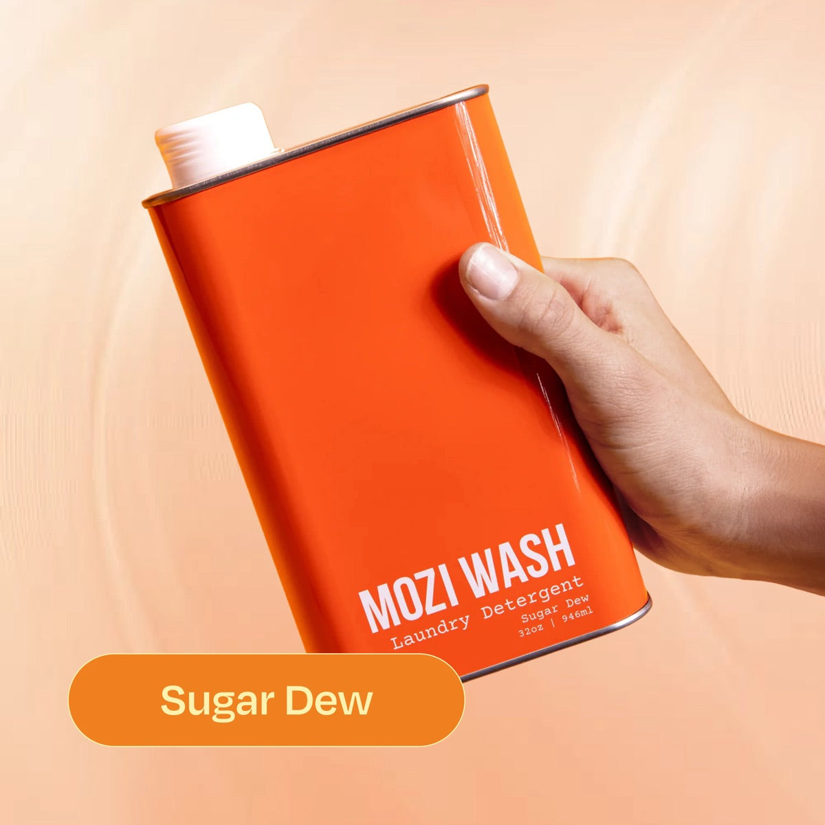 Sugar Dew Mozi Wash laundry detergent bottle held in hand