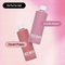Two Mozi Wash laundry detergent bottles in a perfume set, labeled 'Vanilla Moon' and 'Desert Poppy', set against a pink gradient background.