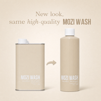 Two MOZI WASH containers on a warm beige background: a rectangular metal canister with a white cap and a tall cylindrical bottle with a white cap, separated by a curved arrow. Text above reads, 'New look, same high-quality MOZI WASH.